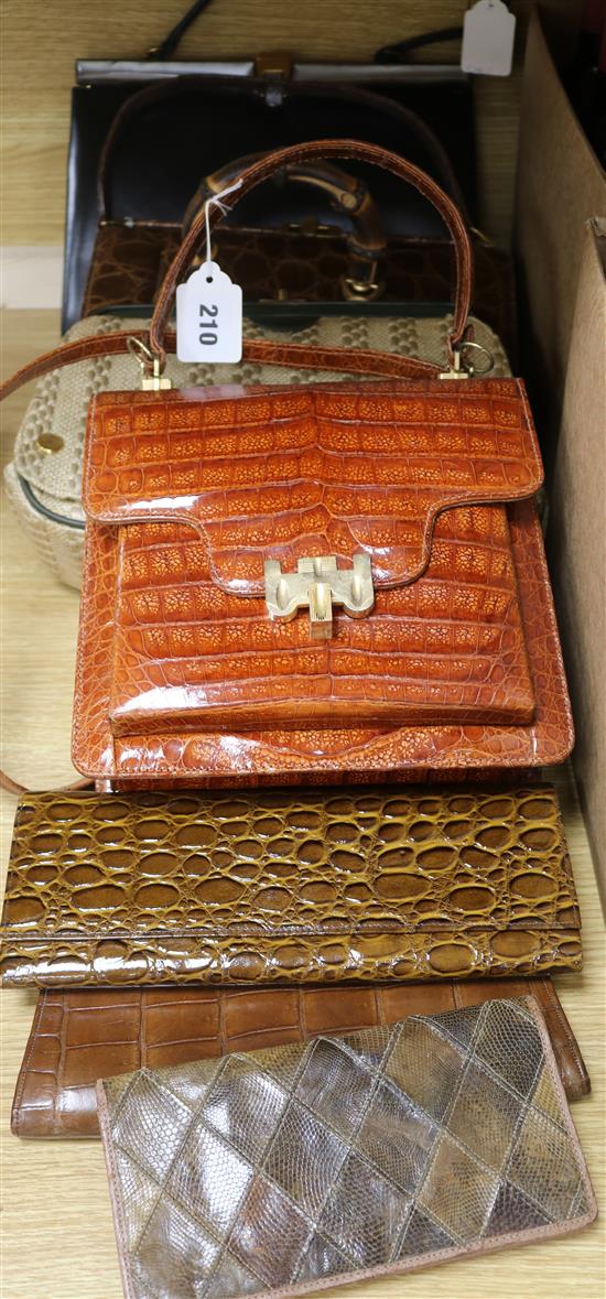 A collection of mixed crocodile and skin handbags